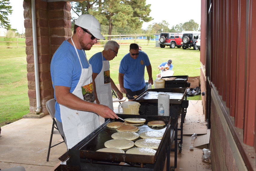 Neshoba General CEO Lee McCall, Ron Dipalma and Neshoba Central Superintendent Lundy Brantley man the griddles Monday for the Rotary Club’s annual Pancake Supper fundraiser.